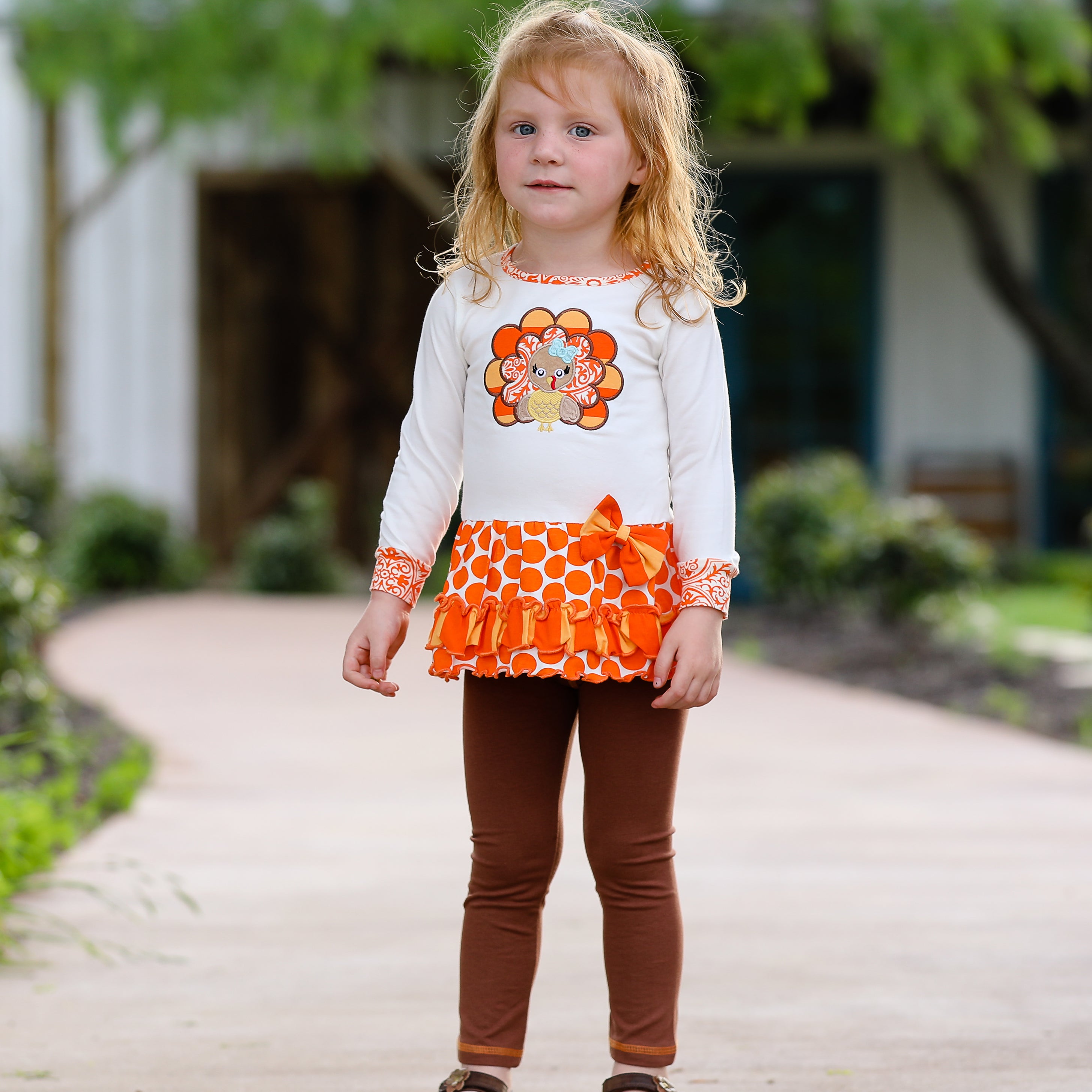 AnnLoren Big Little Girls Autumn Turkey Tunic & Leggings featuring a turkey applique, cream tunic, and orange knit leggings.